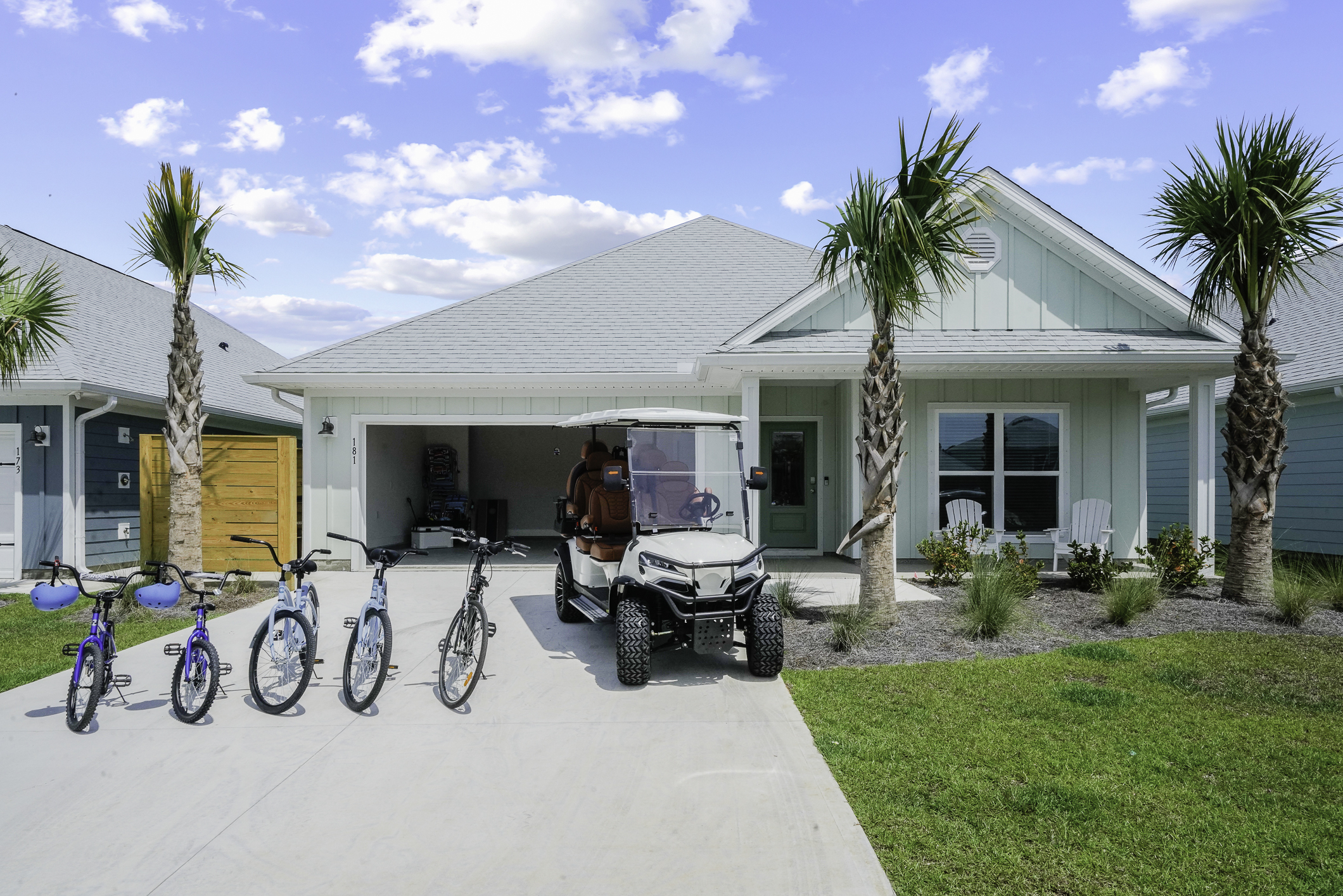 Spacious garage equipped with a 6-seater cart and complimentary bicycles for exploring