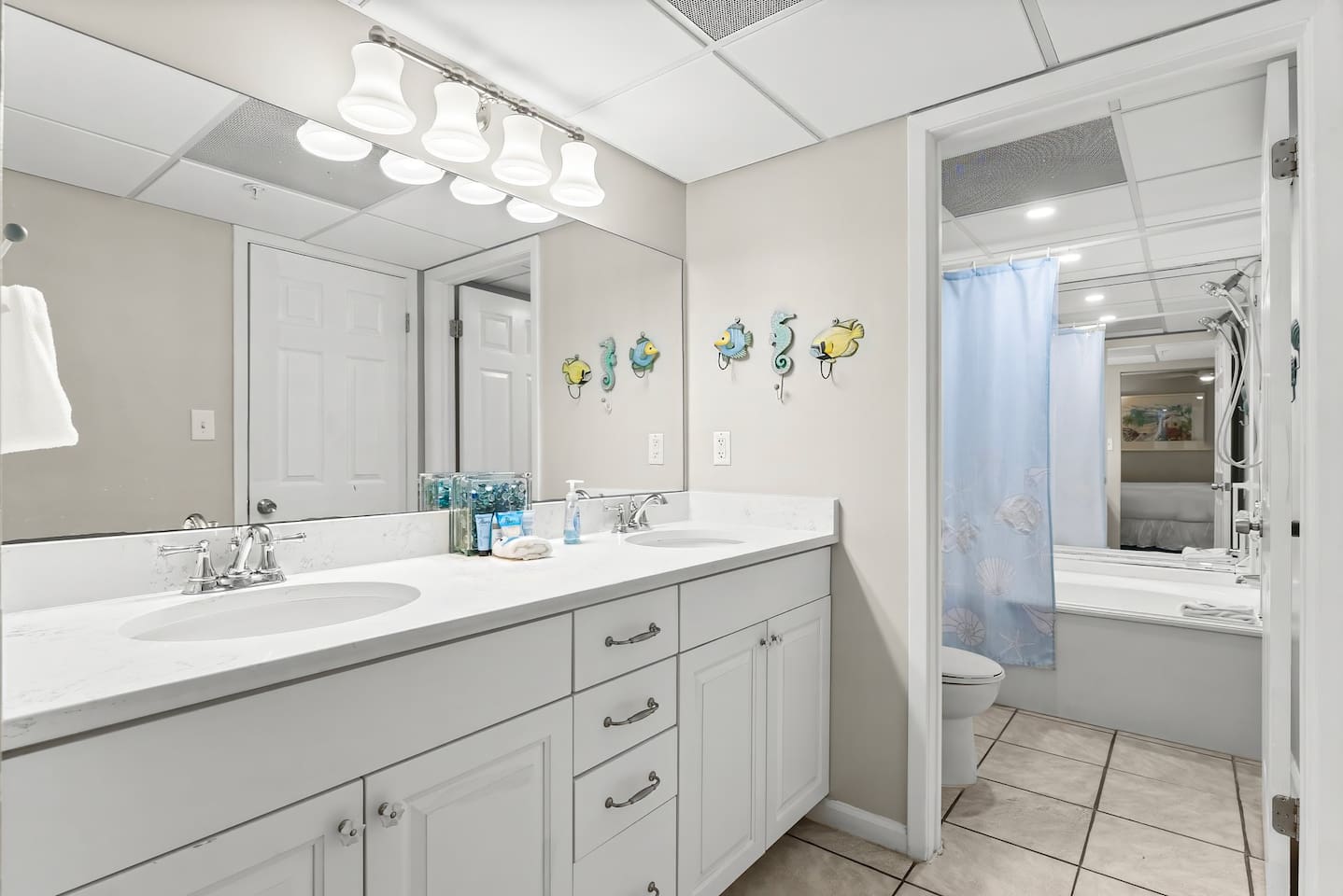 Double vanity leading to guest bathroom
