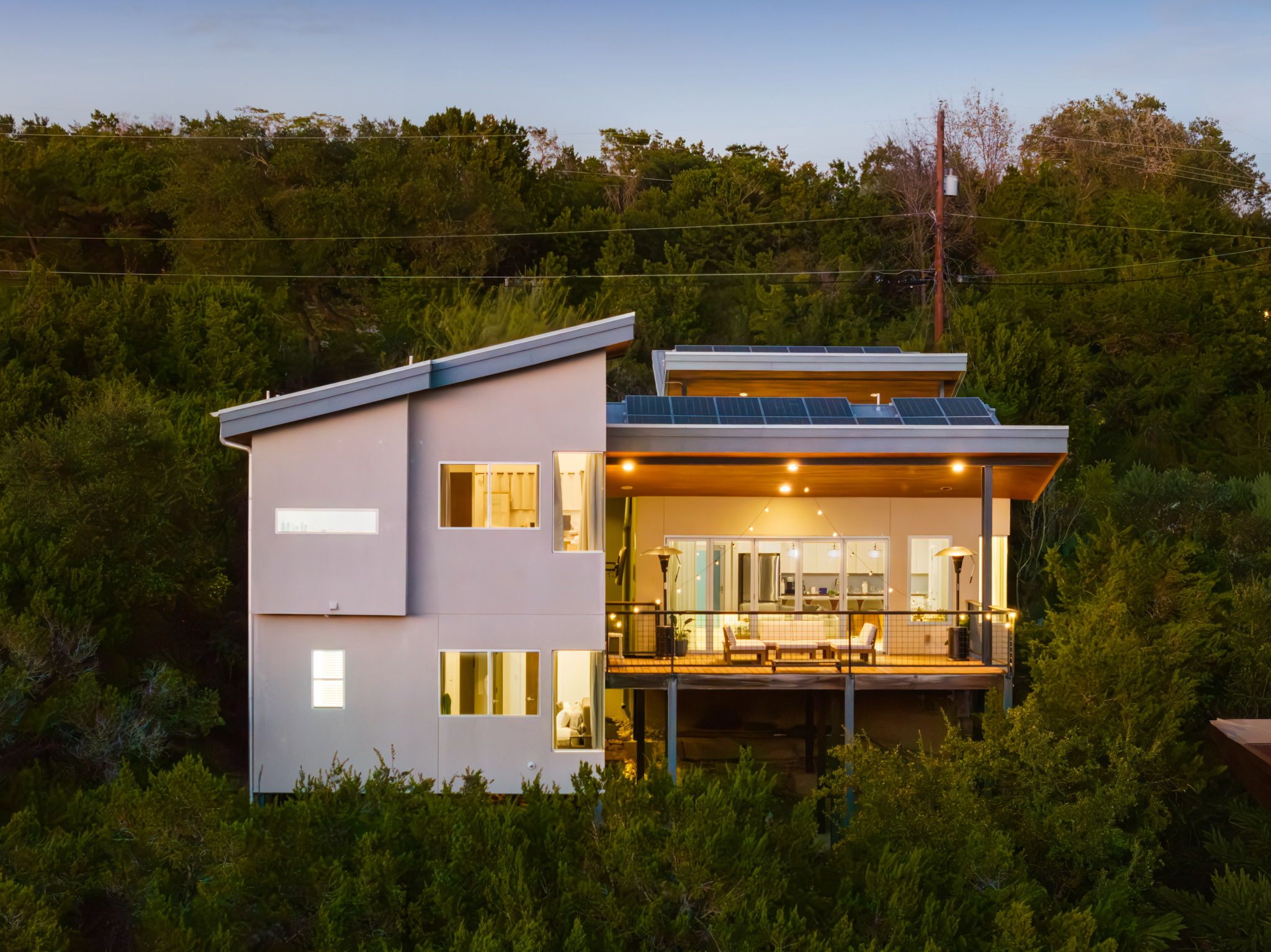 Warm evening views of the home surrounded by nature