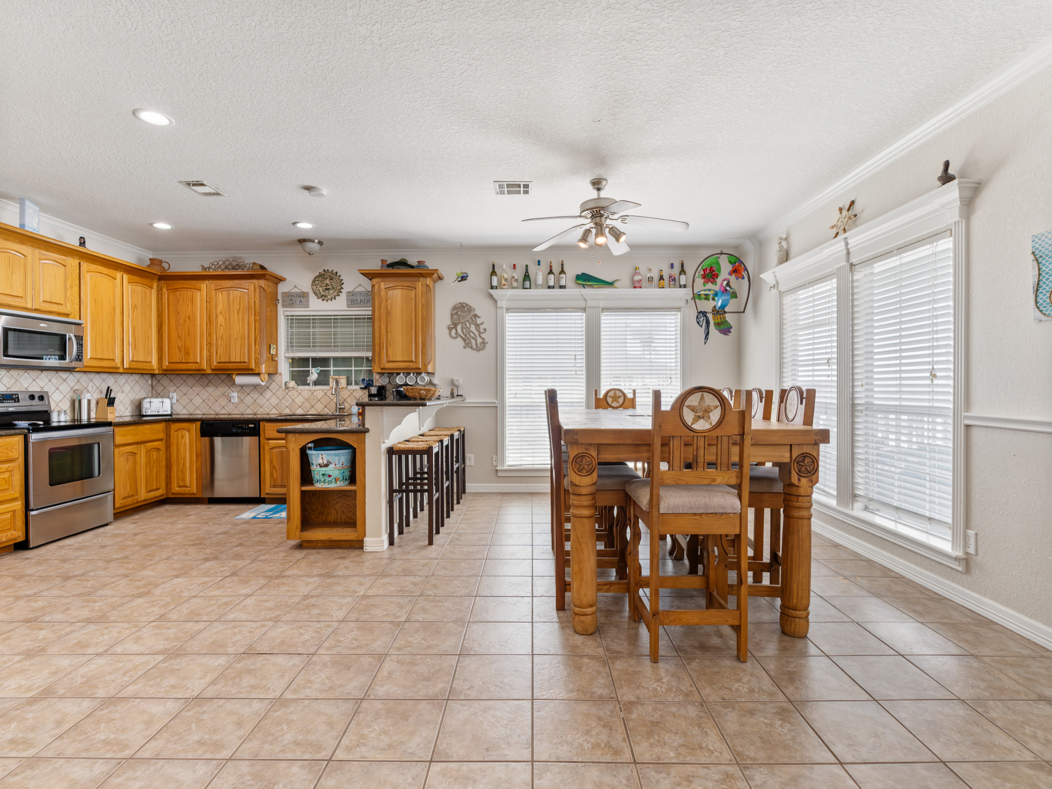 View of dining room and kitchen. Dining room table seats 10