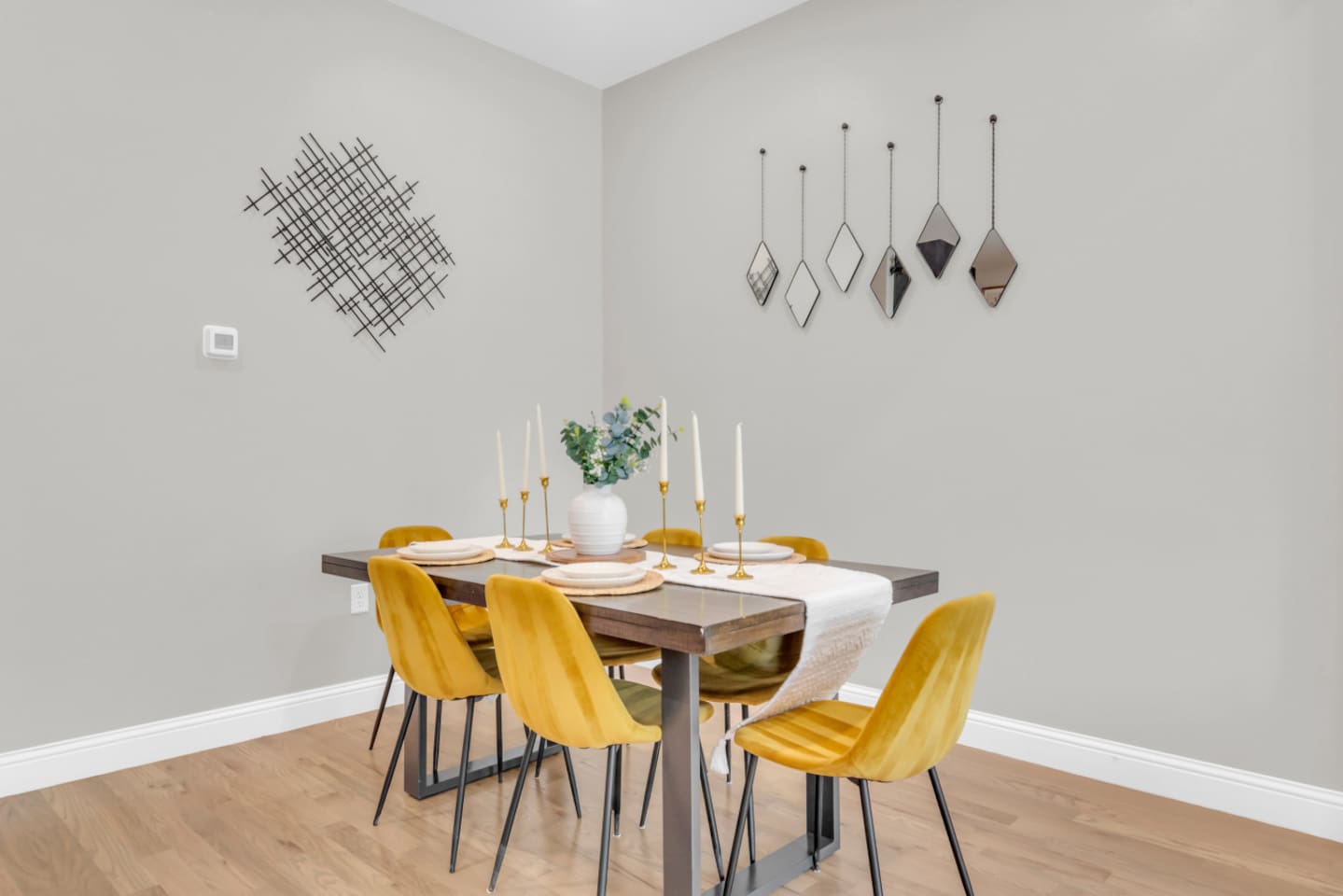Dining setup for 6 with fresh florals and bright modern accents.