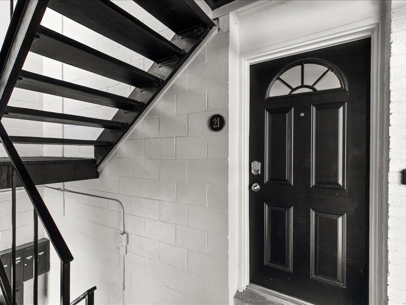 Private entrance with secure keyless access and charming exterior details.
