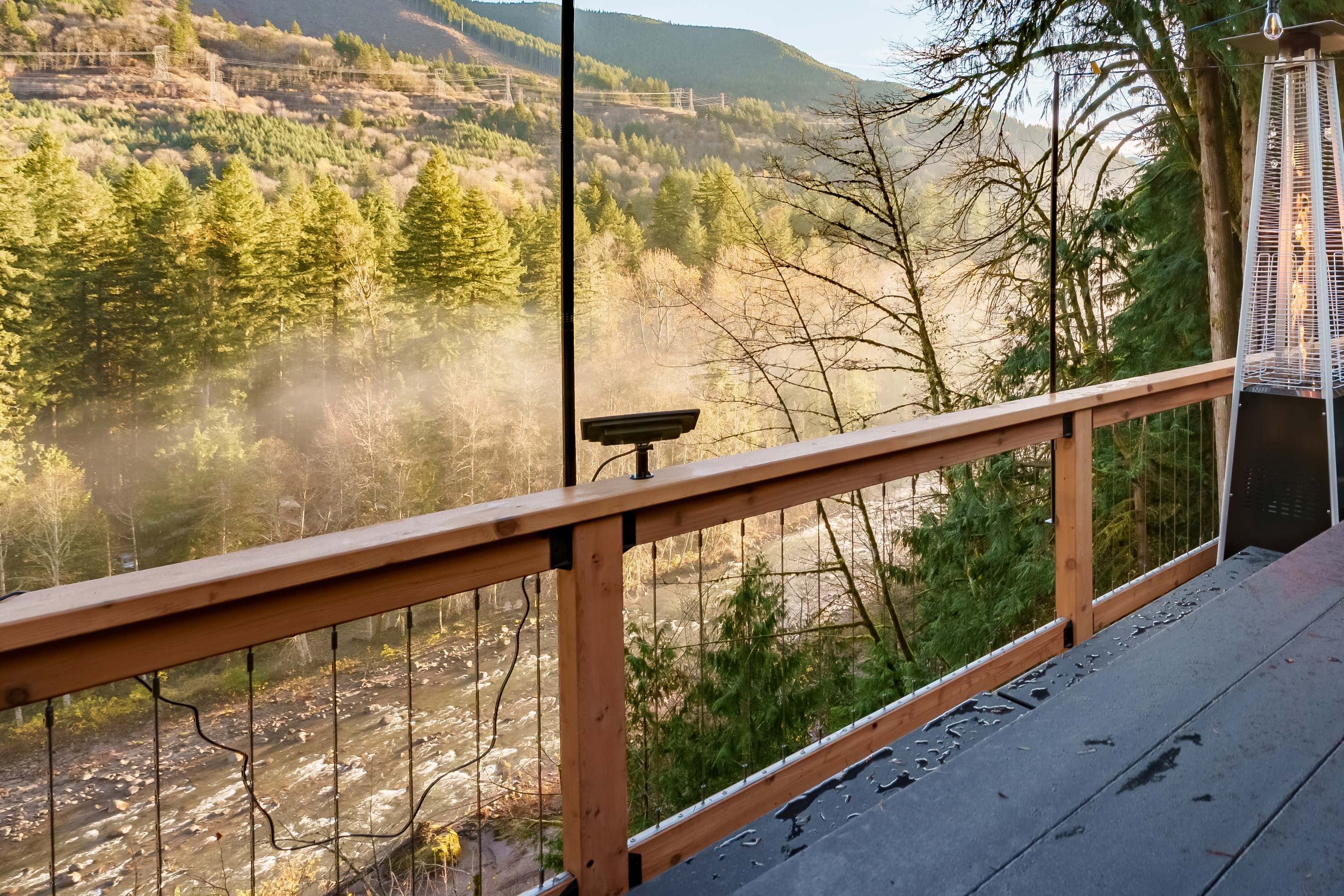 Take in the peaceful sound of the river from the deck as mist rises through the trees—an unforgettable backdrop for morning coffee or quiet evenings in the mountains.