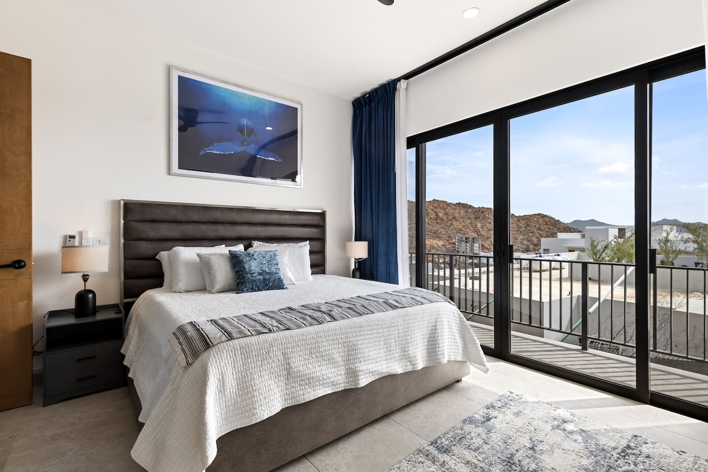 Luxurious king-size bed, plush bedding, and abundant natural light. Ideal for a relaxing stay in this stunning Mexico getaway.