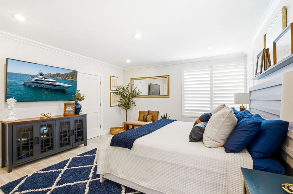 Rest easy in this bright and comfortable suite featuring ample storage and smart TV at The Yacht Club.