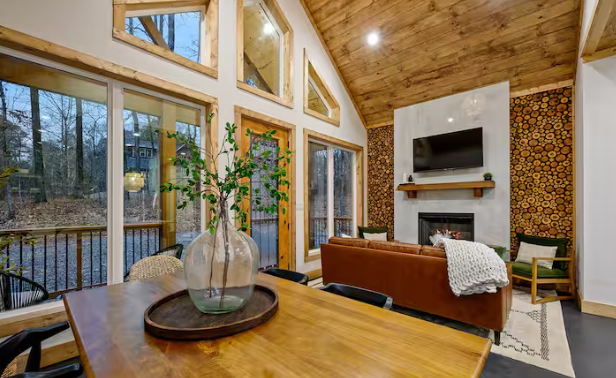 Open-concept living space with forest views