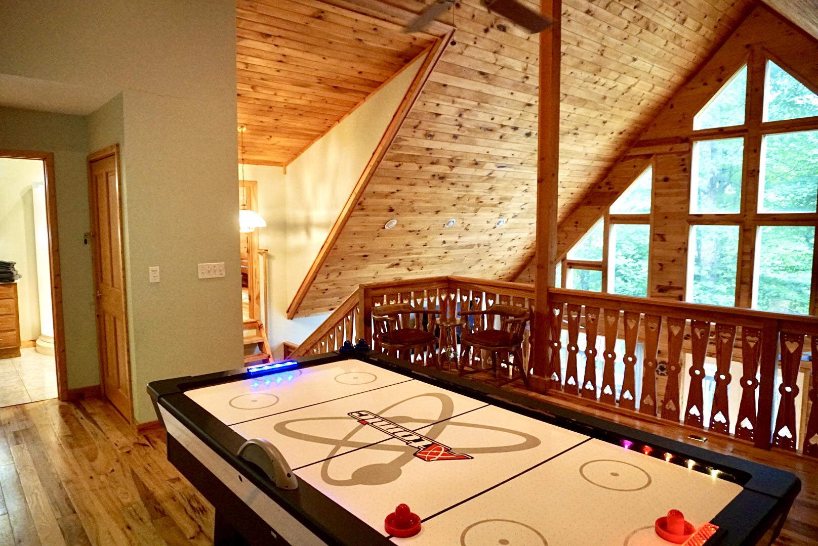 Enjoy friendly competitions and stunning views in this lively air hockey space!