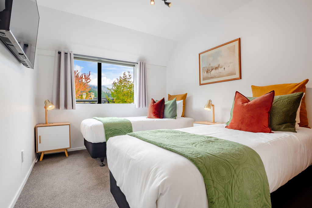 After days around Queenstown, Lake Wakatipu or the ski fields, this downstairs bedroom gives Fernhill Mountain Escape a quiet place to reset.