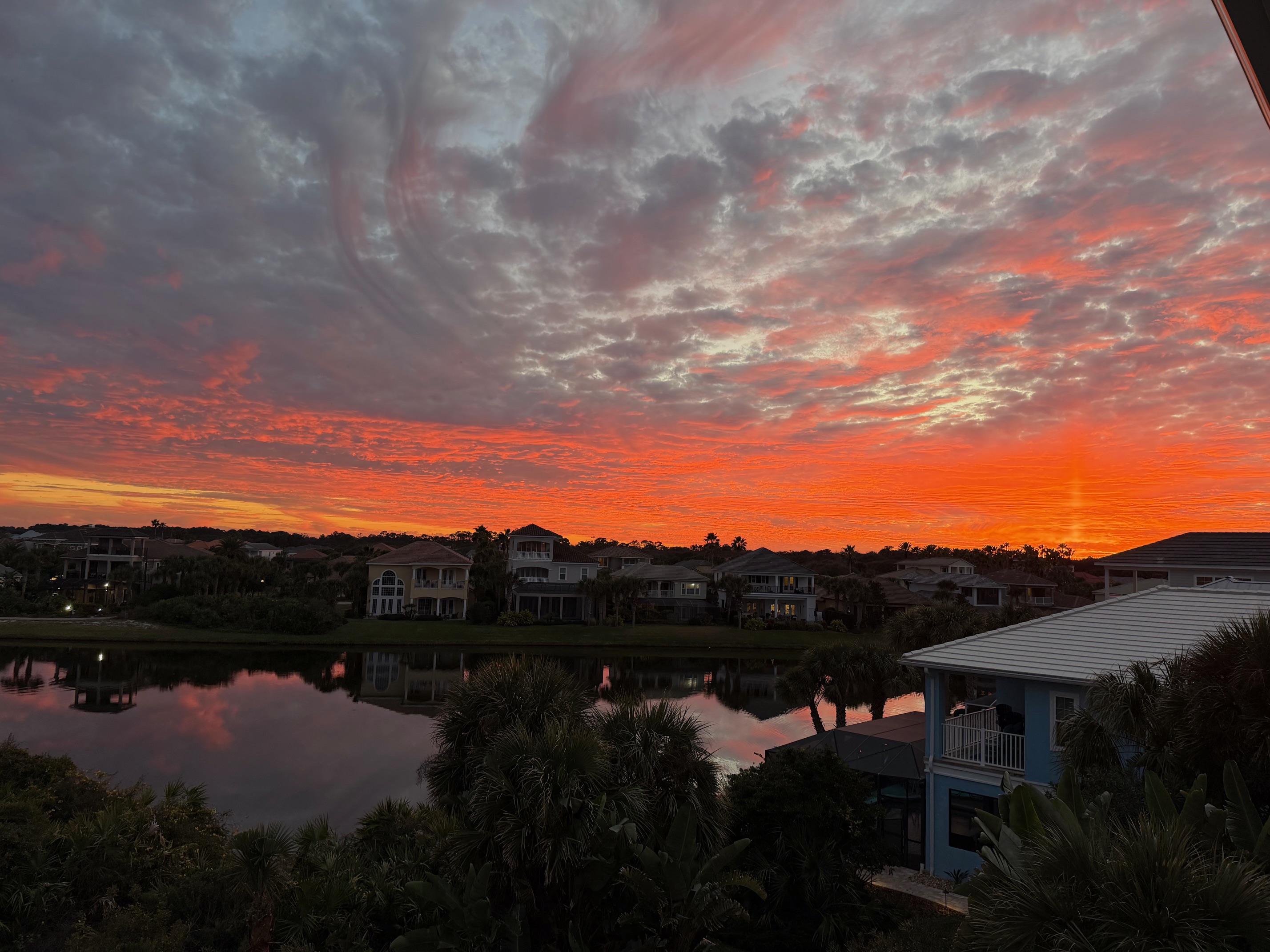 Everyone ends up on the balcony when the sky does this. The lake turns to glass, the horizon catches fire, and the kids go quiet for once—then you all laugh about it later, like you planned the perfect ending to the day.
