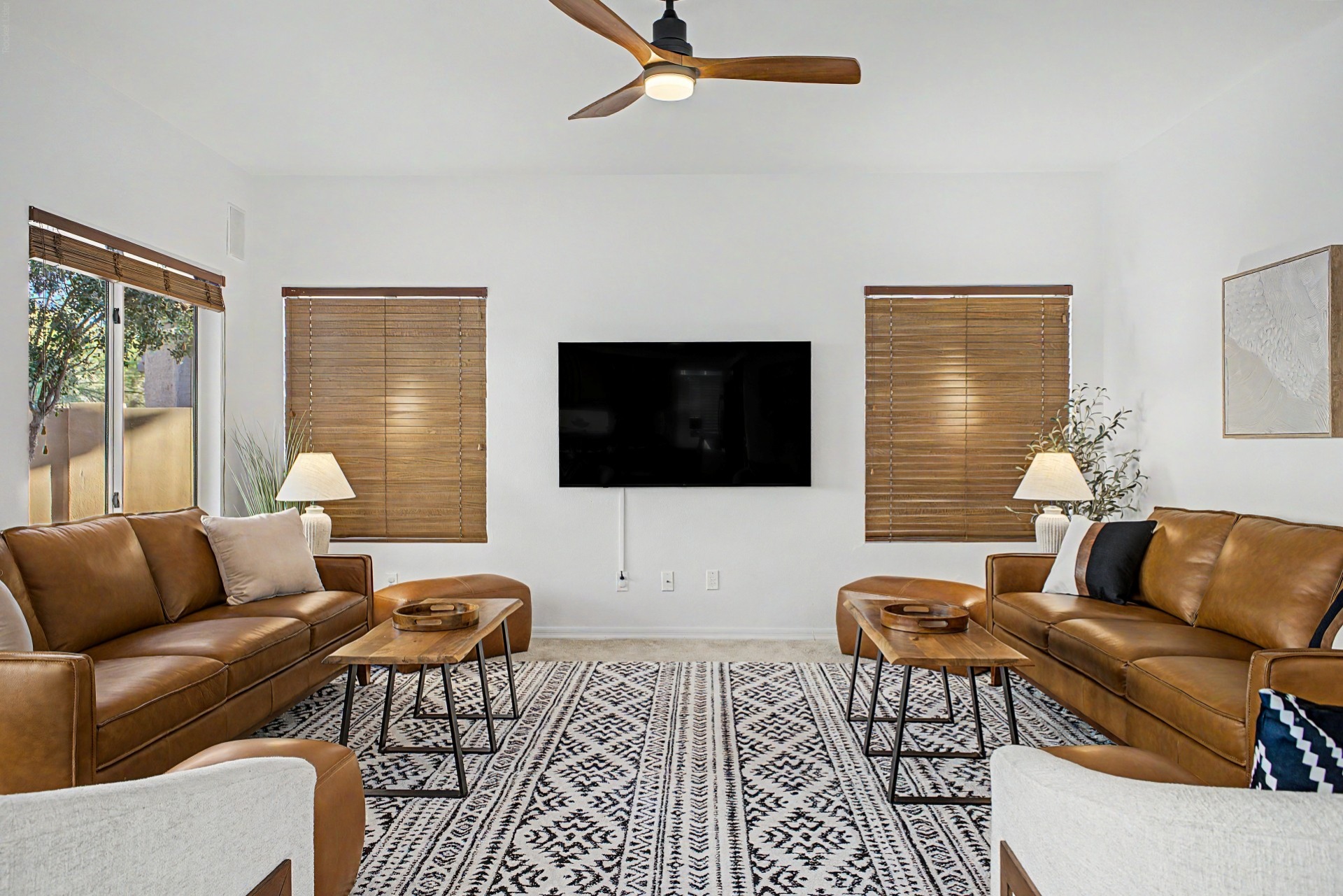 Family Room with 65" Smart TV, ceiling fan and plenty of seating