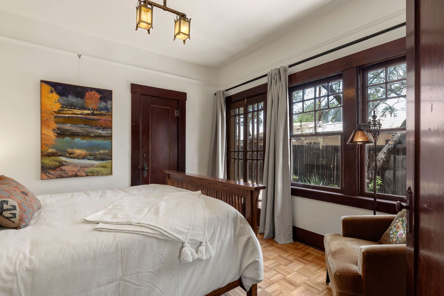 front bedroom with french doors to private patio