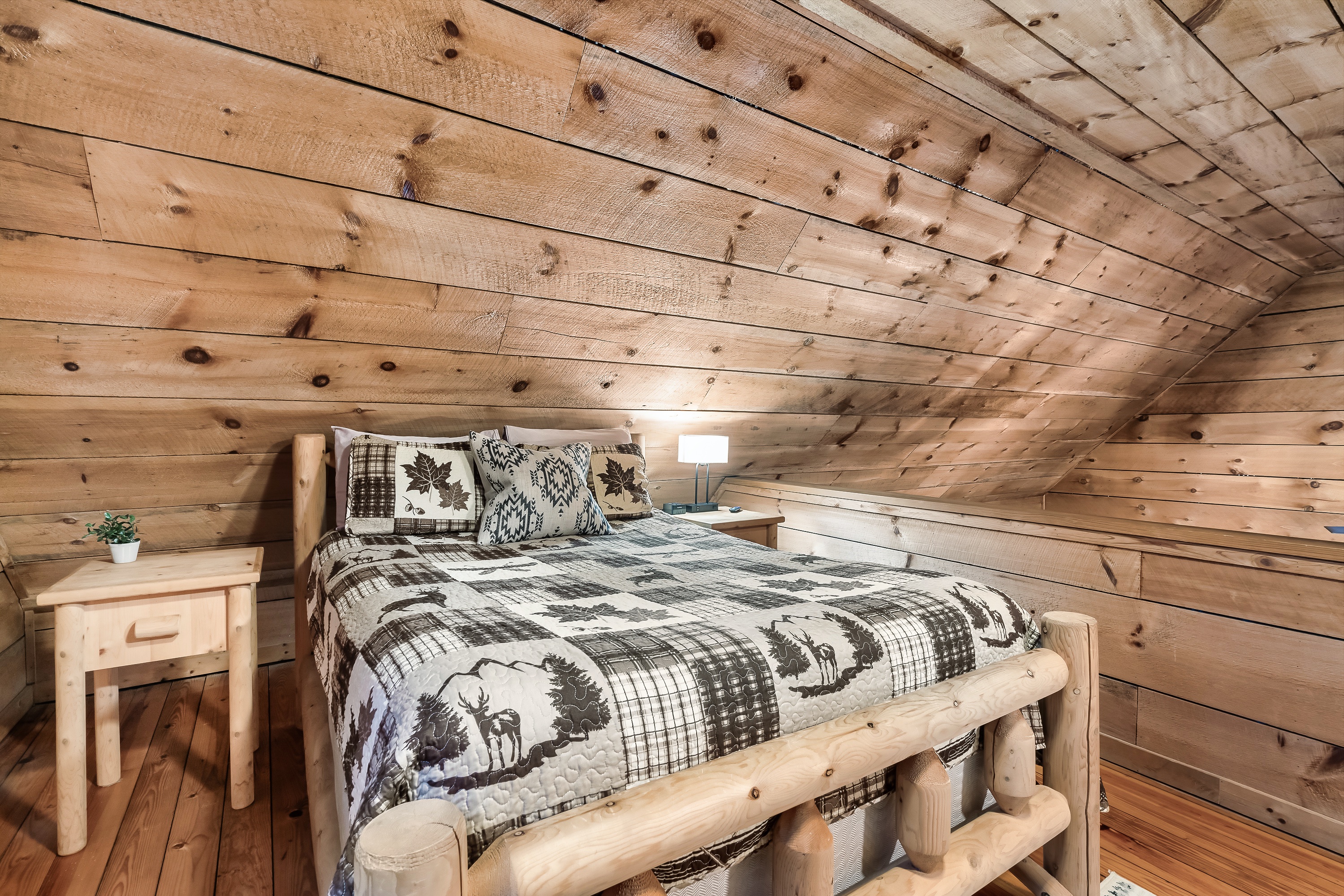 Loft bedroom tucked under the beams