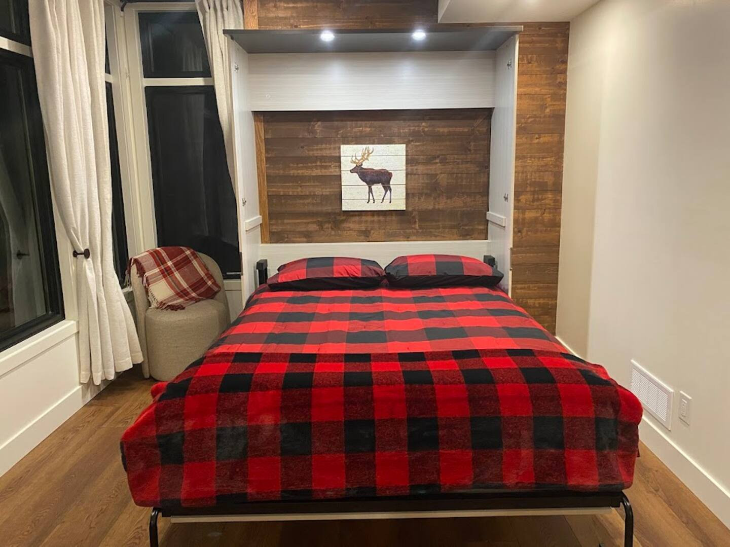 Bedroom 3 on lower level with Queen murphy bed laid out for sleeping.