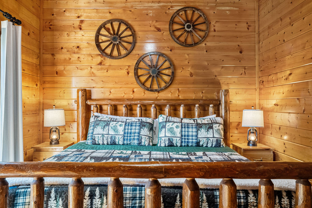 Wake up in a plush king-size bed surrounded by the peaceful beauty of the Smoky Mountains, where soft morning light filters through the trees just outside your window.