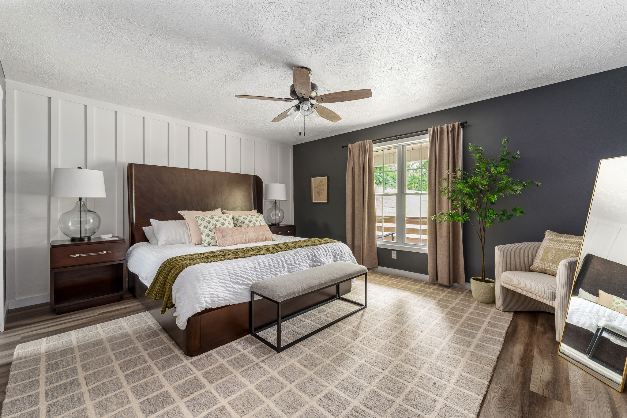 Suite dreams start here This spacious king bedroom blends modern design with earthy tones, cozy textures, and a view of the porch—your private retreat for ultimate R&R. 🛏️🪴