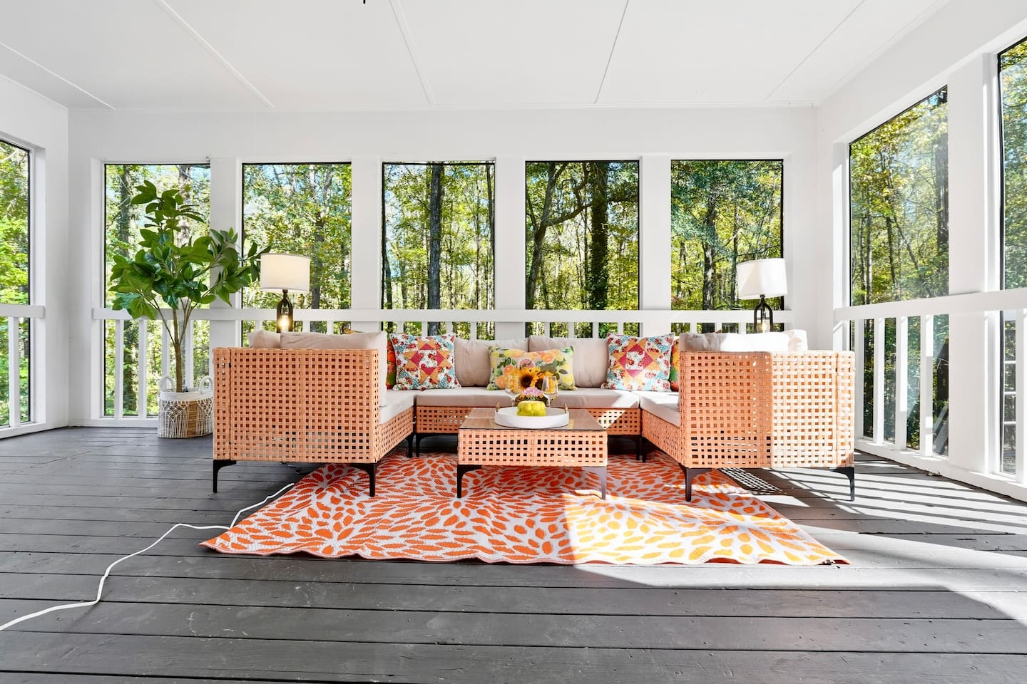 Cozy sunroom with warm orange tones, perfect for relaxing and soaking up the sunshine on bright days.