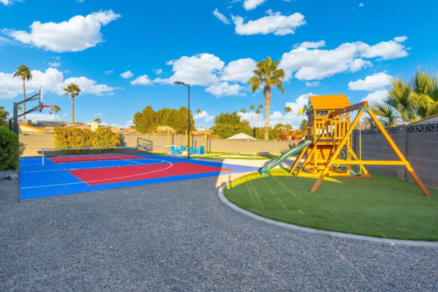 Sport court on one side, play structure on the other, this corner of the yard keeps every age entertained at once.
