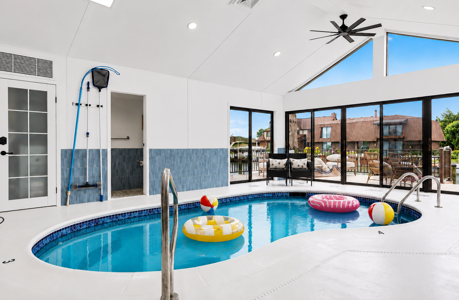 Relax and enjoy year-round swimming in this bright indoor heated pool, featuring vaulted ceilings, skylights, and a spacious open design ideal for both lounging and entertaining.
