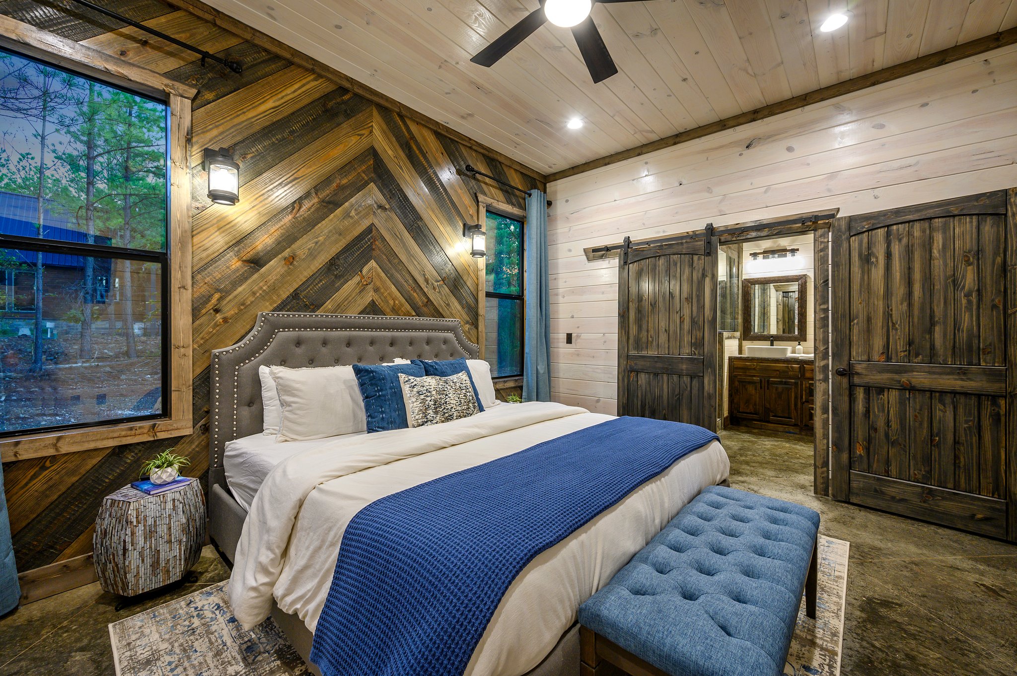 Inviting rustic bedroom with modern comforts and spa-like ensuite