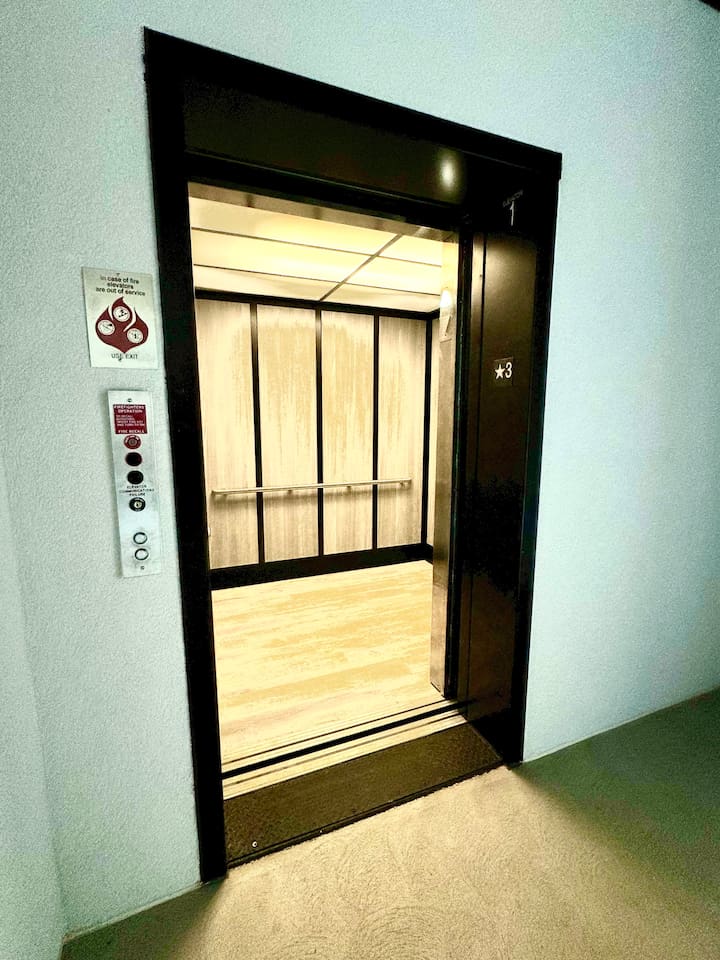 Take the elevator to the 5th floor. The parking lot is the same elevation as the 3rd floor.