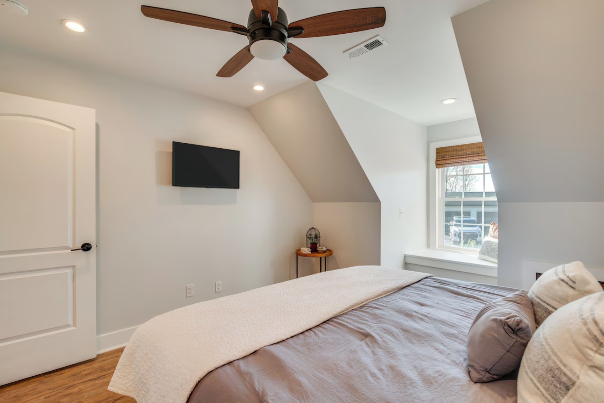Bedroom with ceiling fan and king bed