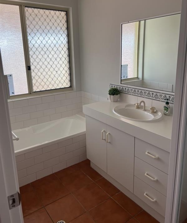 Main bathroom with walk-in shower & separate bath & vanity