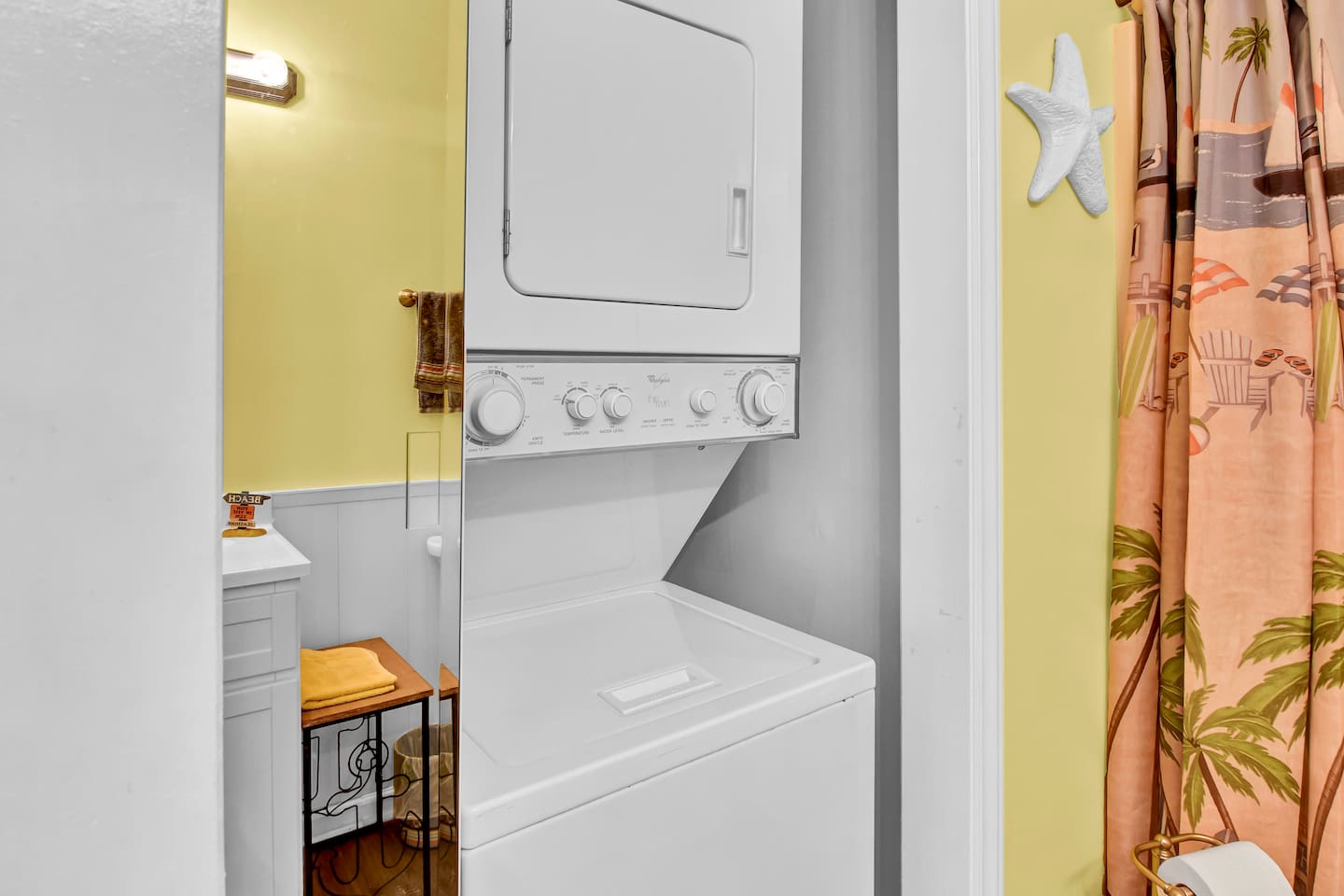 The washer/dryer is located inside of the main bathroom