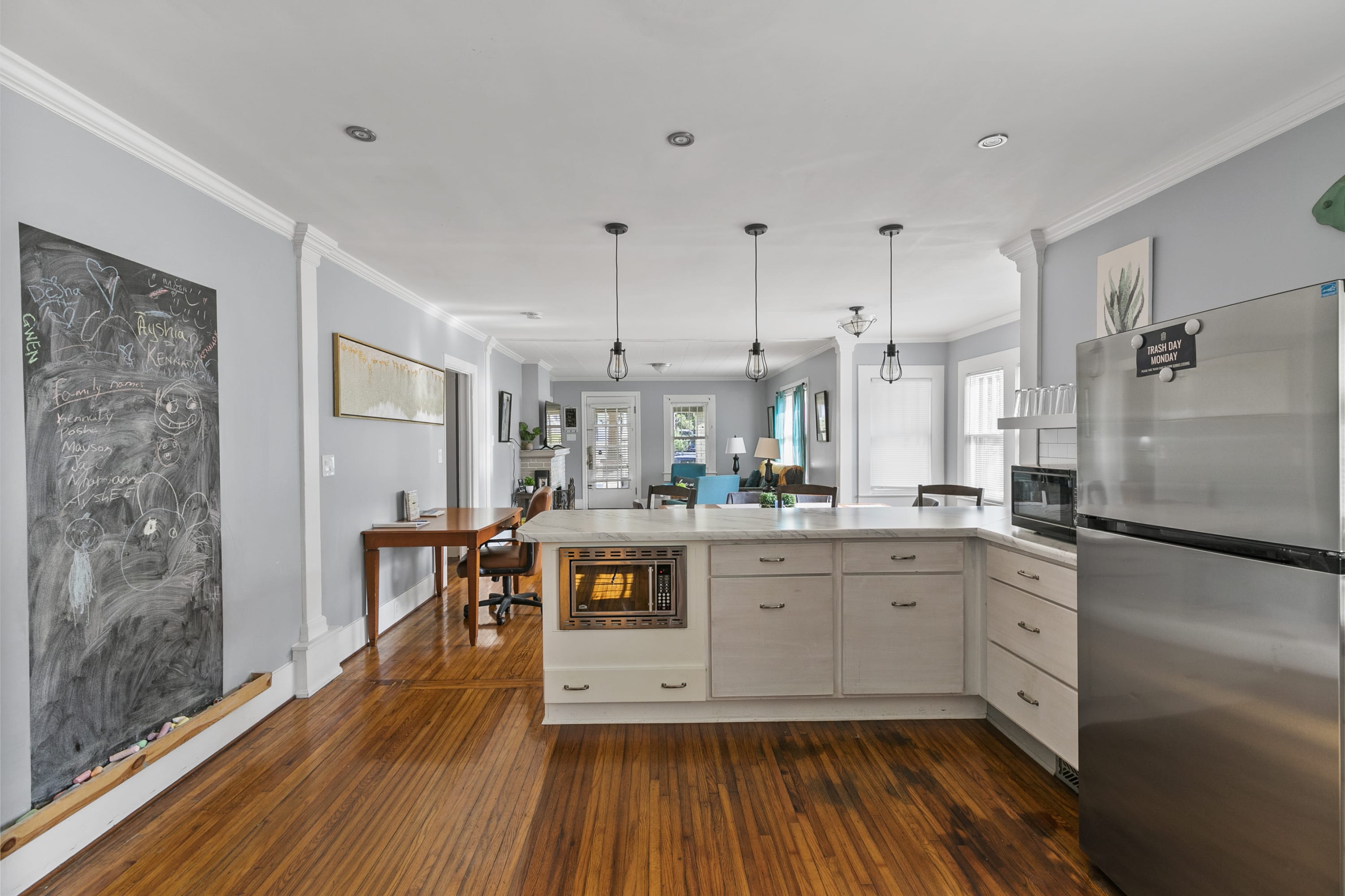 Cook, gather, and connect in a modern kitchen with stainless steel appliances and bar seating