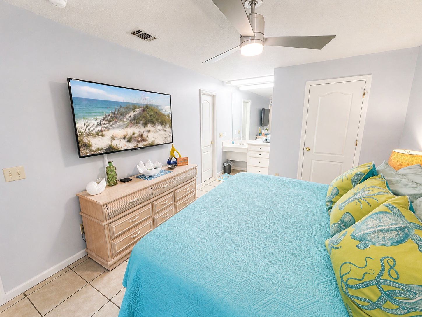 Master bedroom with a king bed and flatscreen TV