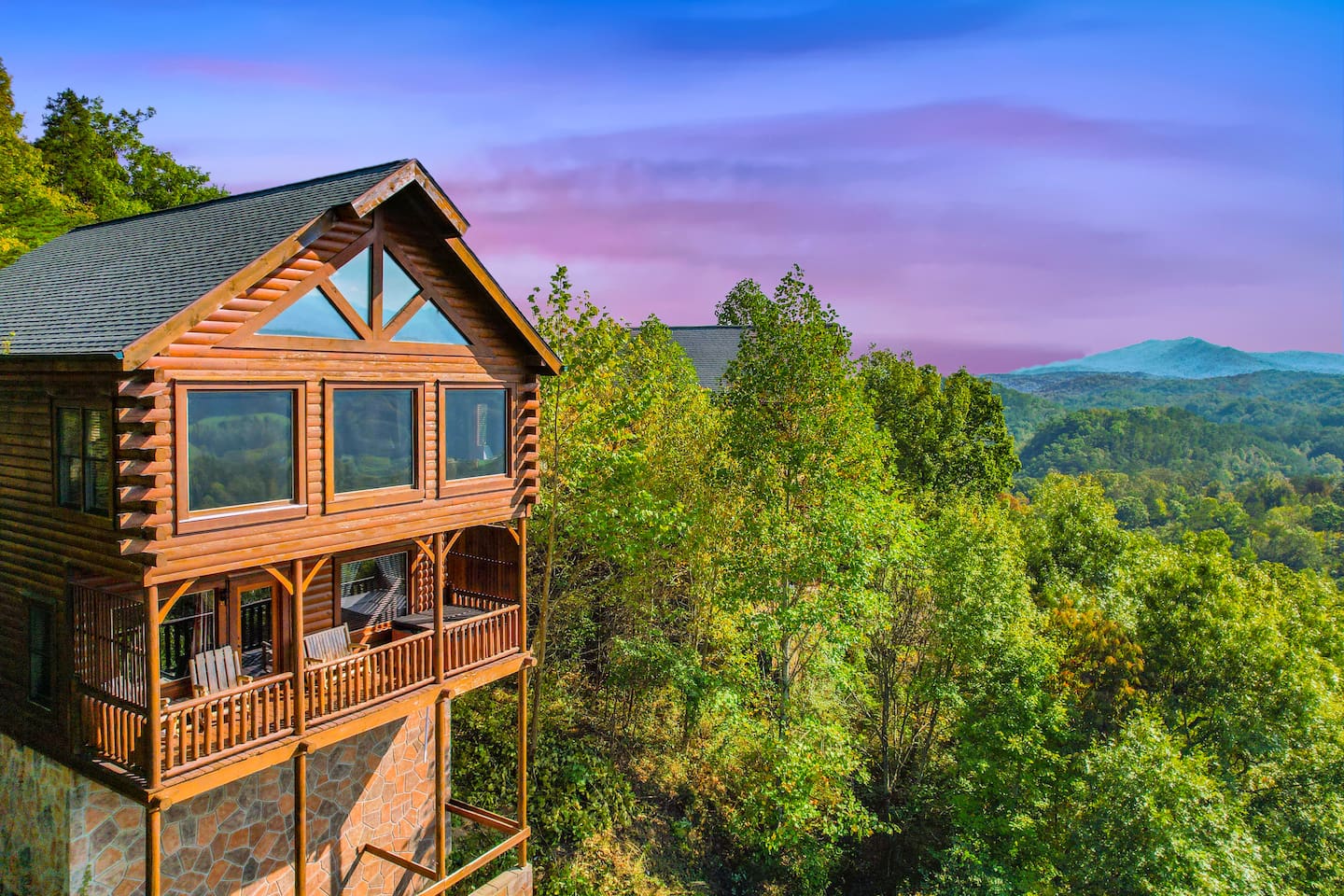 Relax on the porch overlooking a valley and mountain tops