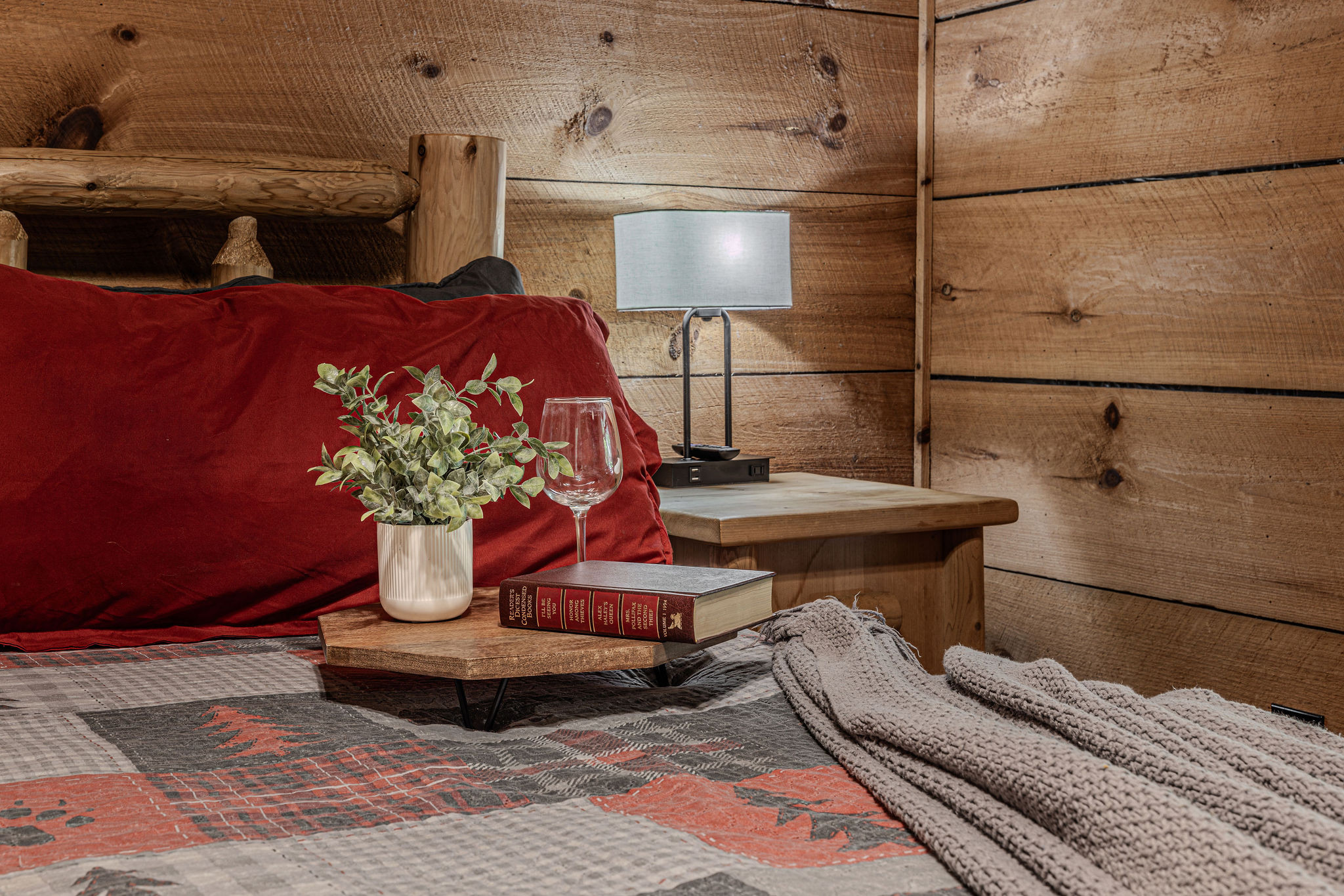 Red plaid, fresh flowers, wine glasses waiting.