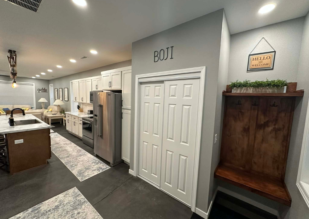 NEW HOUSE: View from the front door into the house. Coat closet near the front door.