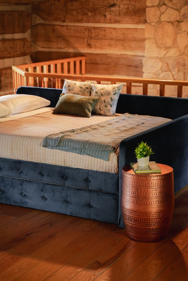 Queen bed with a plush pillow-top memory foam mattress, designed for comfort and relaxation.