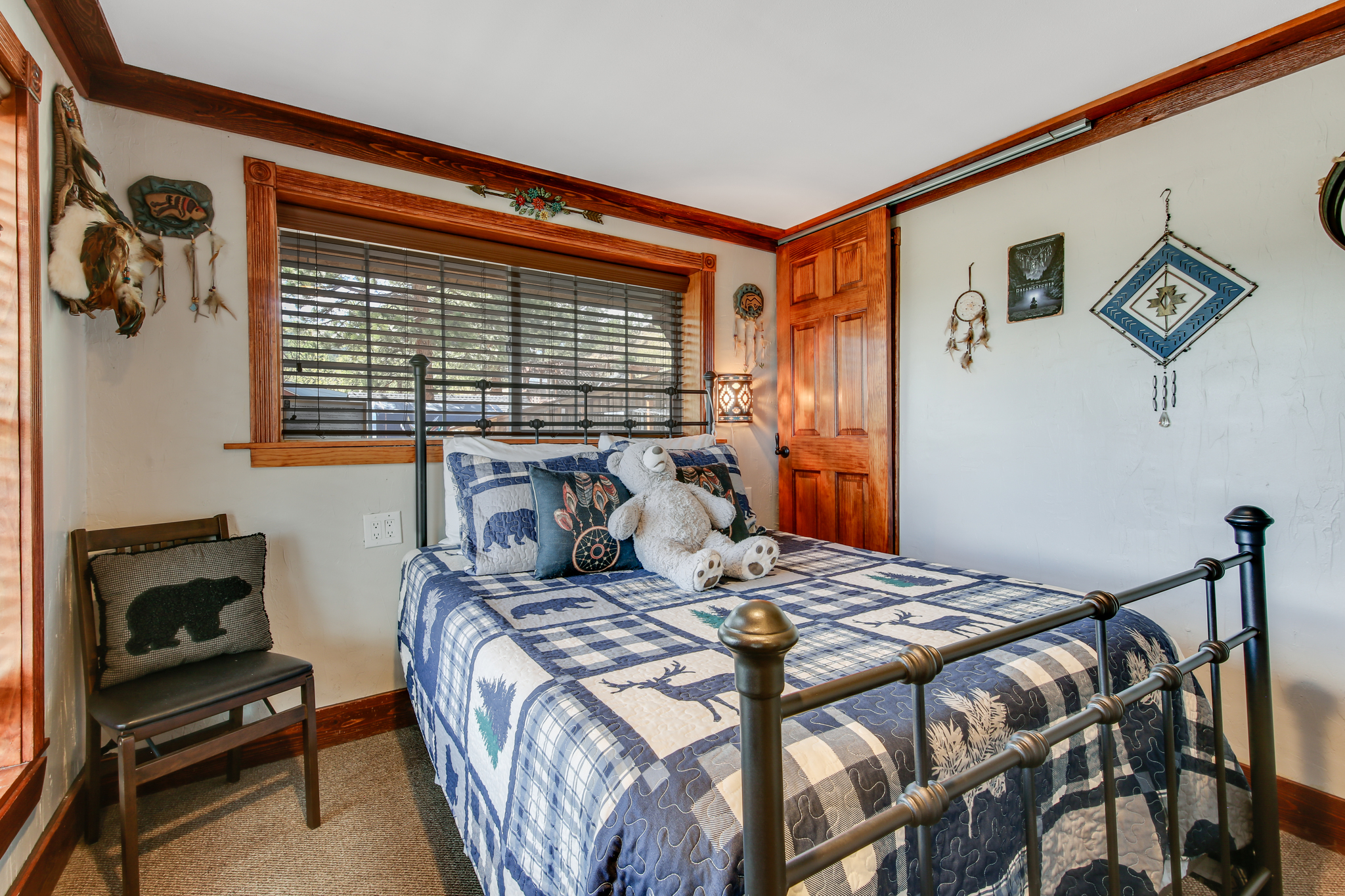 Bright and inviting bedroom with cozy cabin touches.