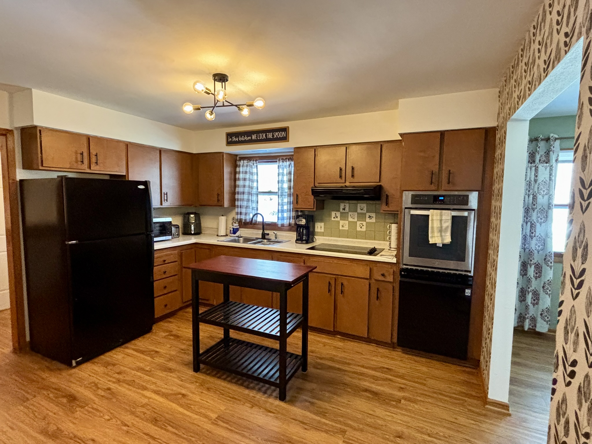 Kitchen: Fully stocked utensils and cookware. Microwave, drip coffee maker, air fryer, oven, stove, dishwasher, microwave
