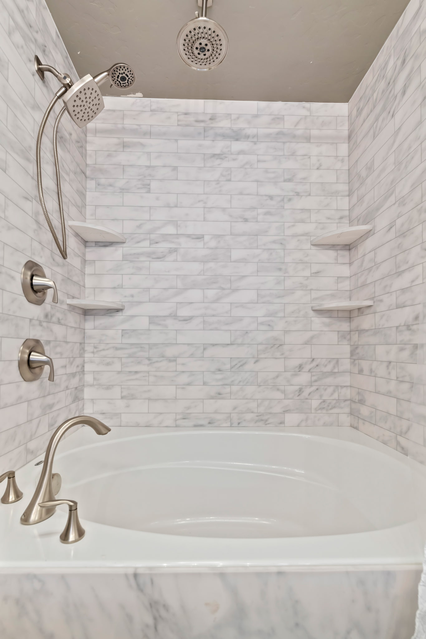 Updated bathroom featuring a large garden tub, creating the perfect space to relax and unwind. 