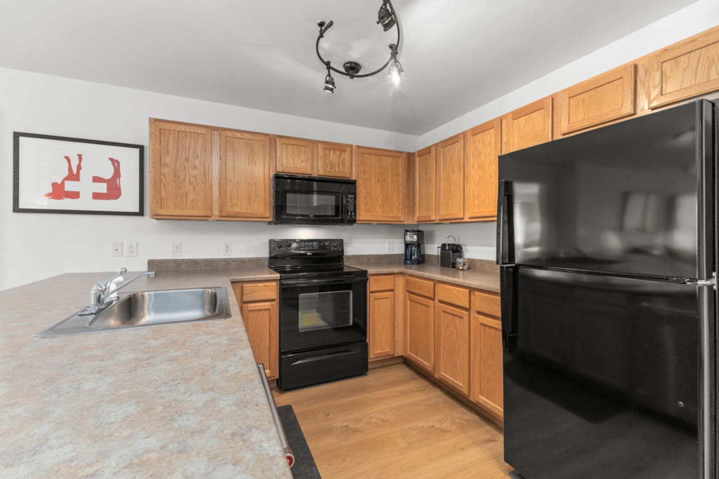 Kitchen – Oven | 4 burner electric stove | Microwave | Refridgerator