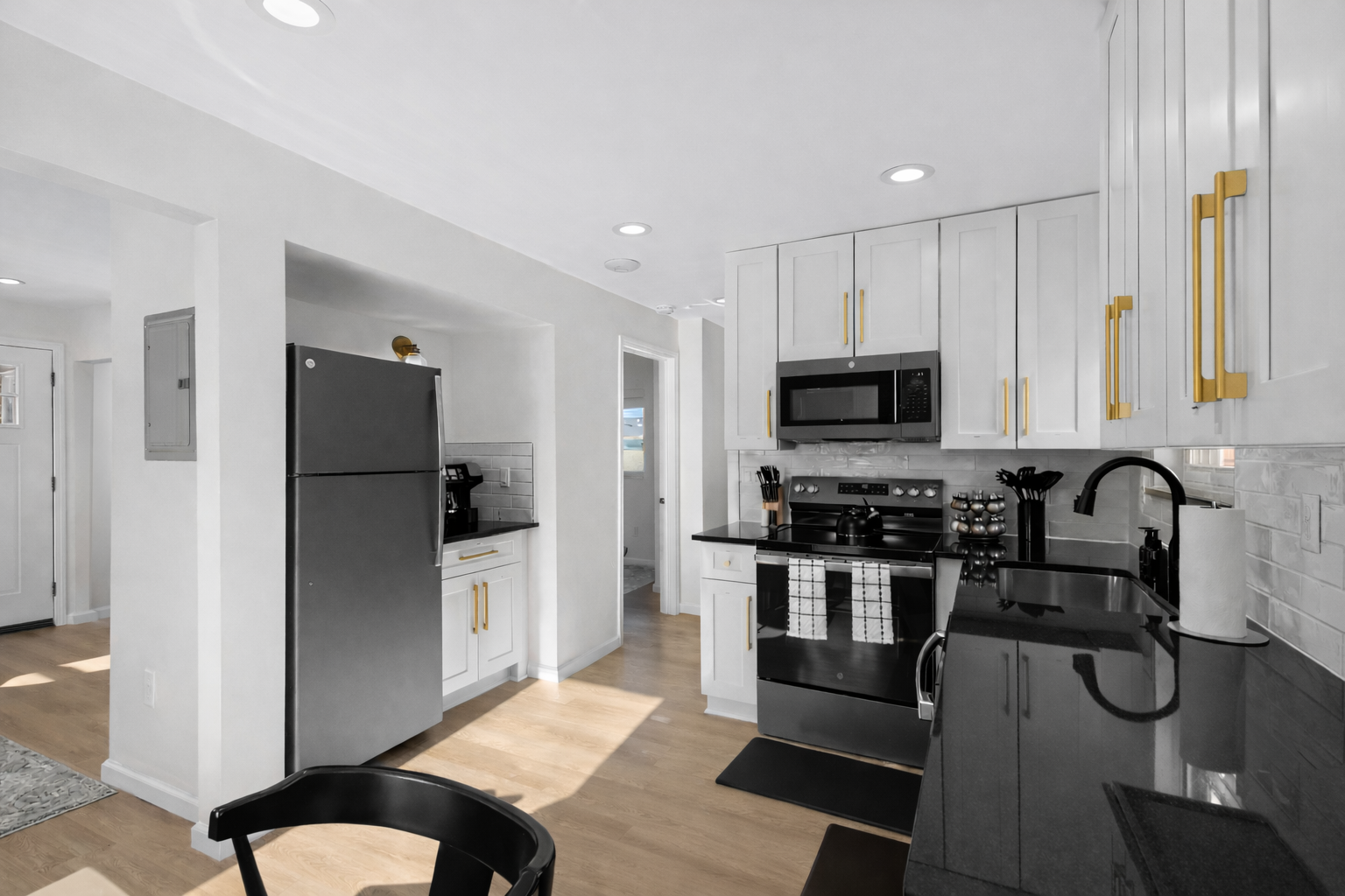 Modern, fully equipped kitchen with sleek appliances, generous counter space, and stylish finishes—perfect for cooking, meal prep, or enjoying a night in.