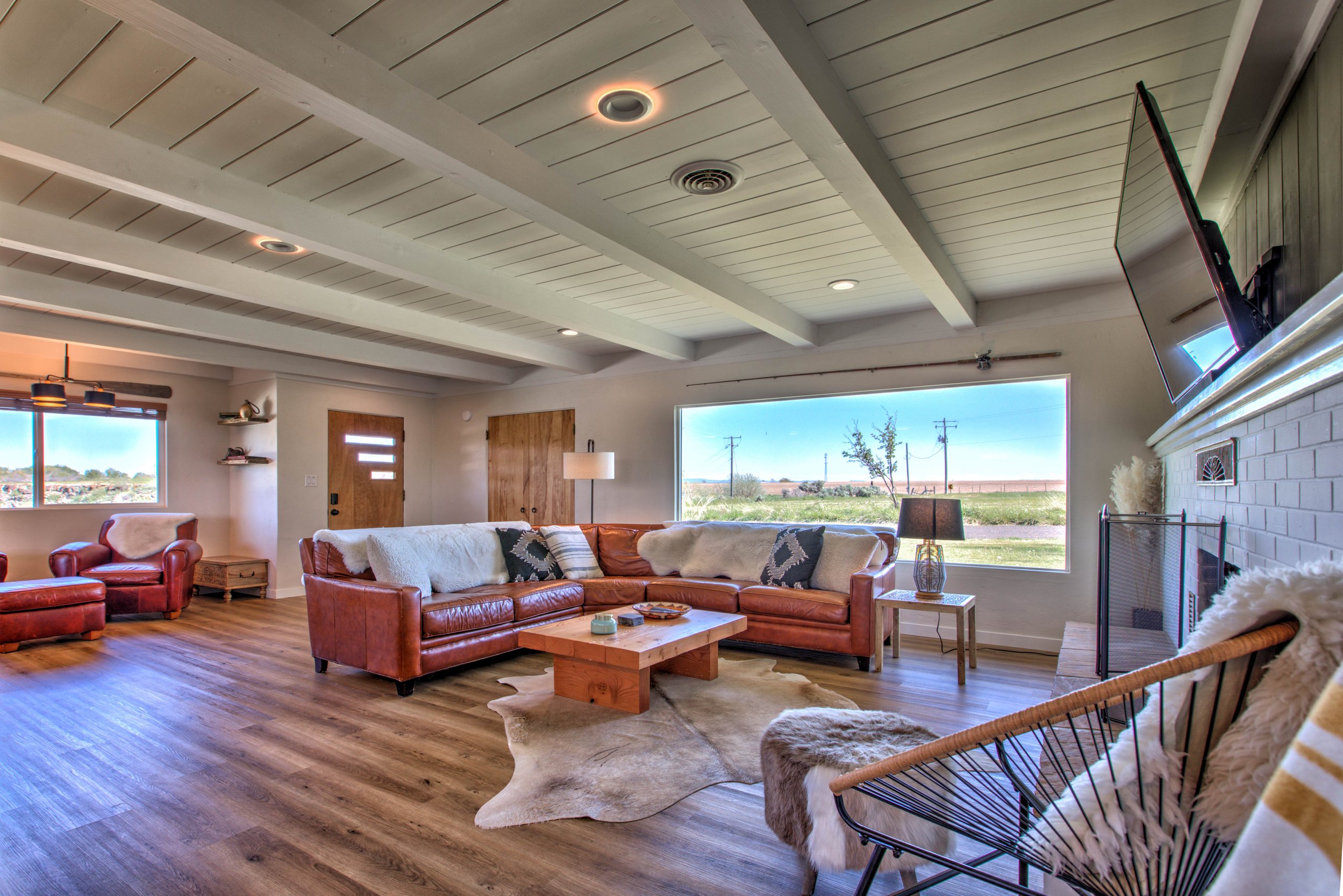 Light-filled living space with the picture window framing the Rock Creek countryside