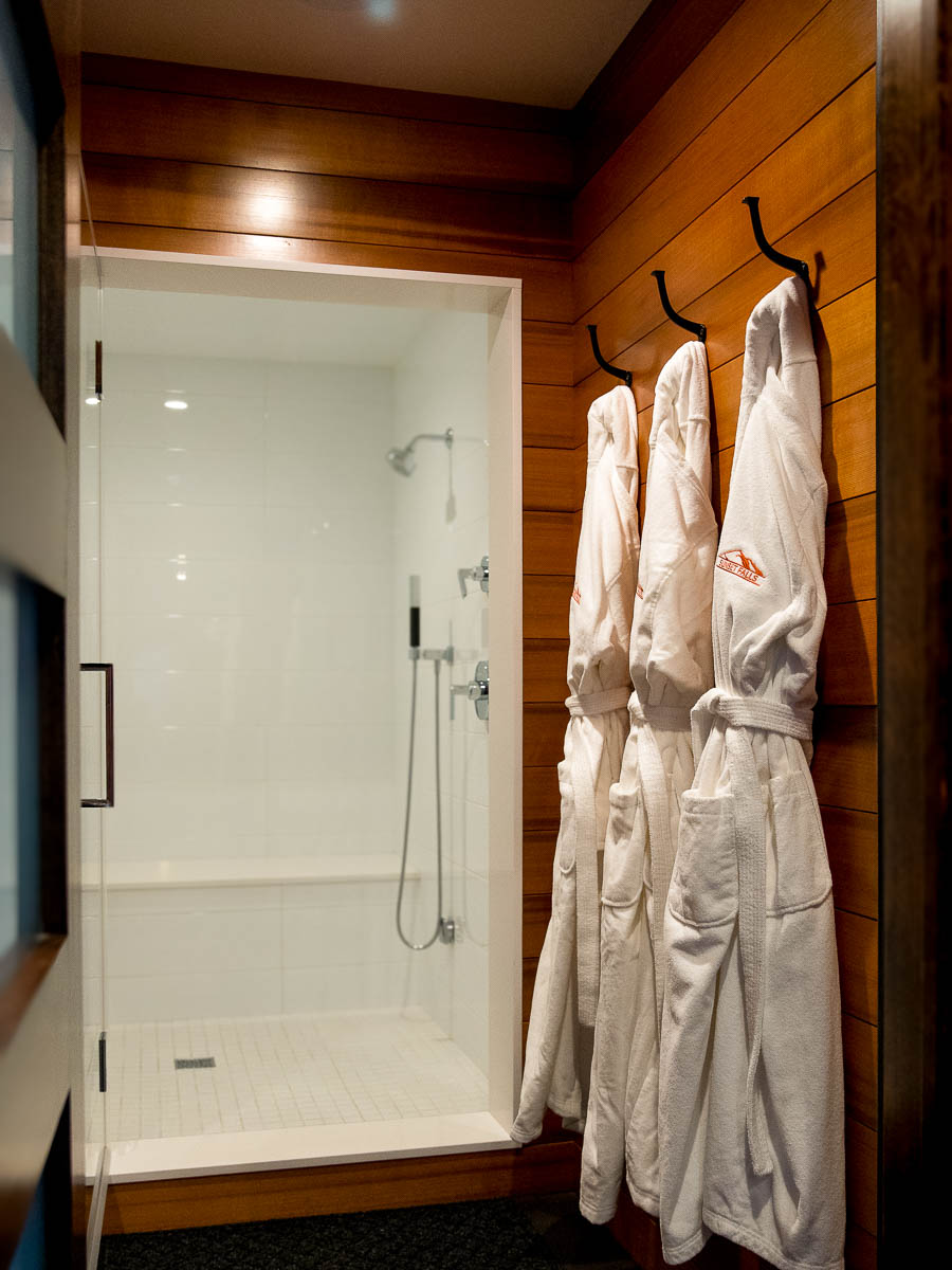 Turkish cotton robes beside the steam-room shower &mdash; Sunset Falls Restore