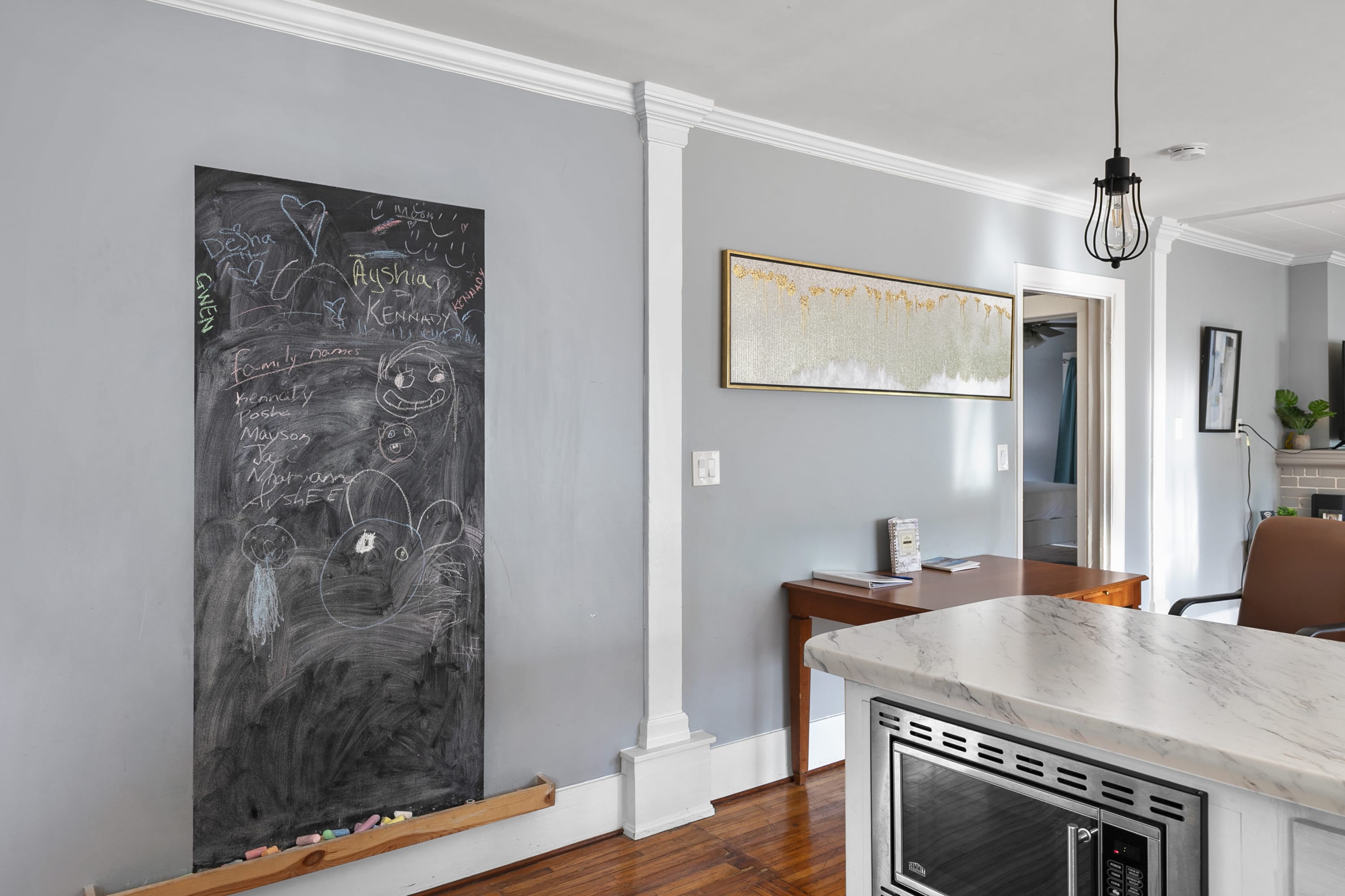 A playful chalkboard wall adds a personal touch—leave a note, a doodle, or your plans for the day