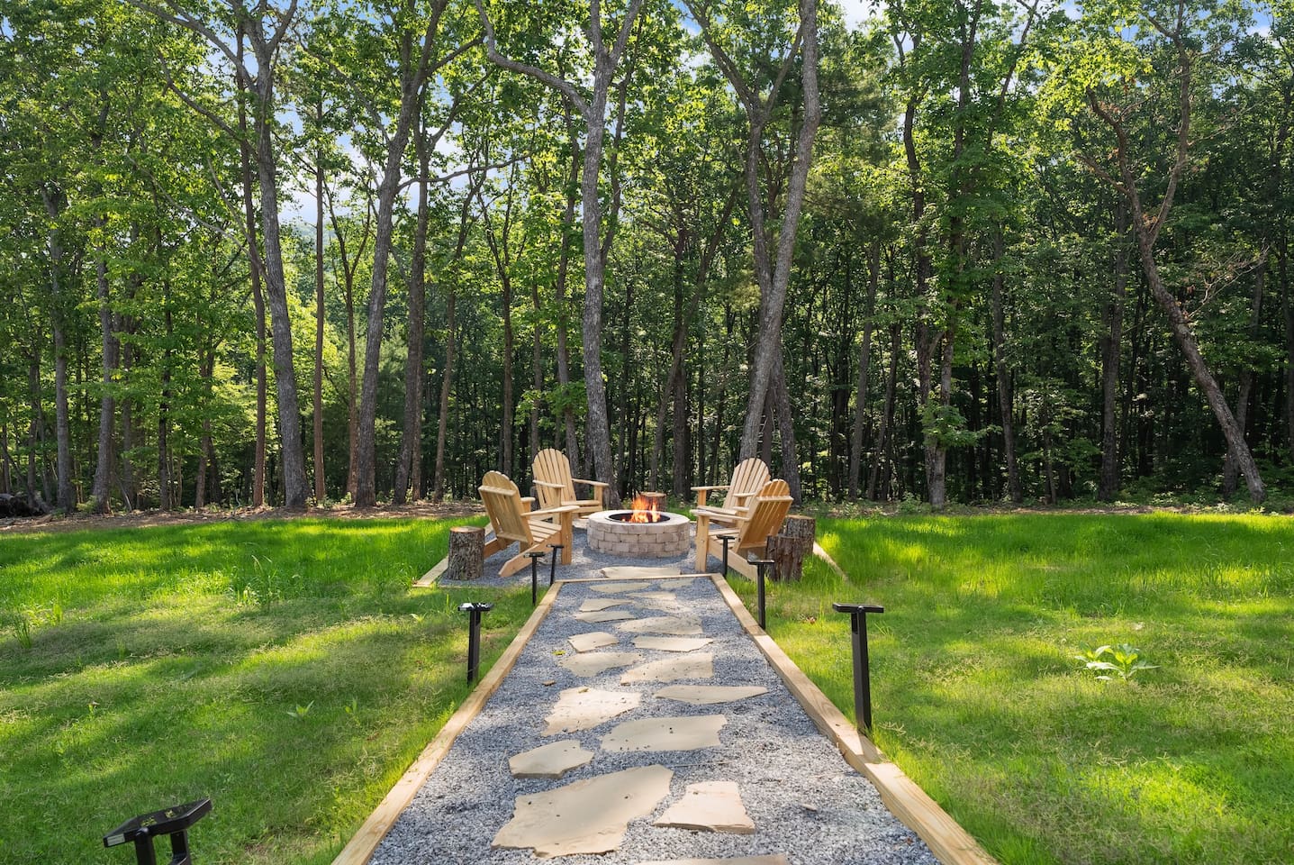 A custom stone pathway leads to your private fire circle, blending rustic charm with modern comfort.