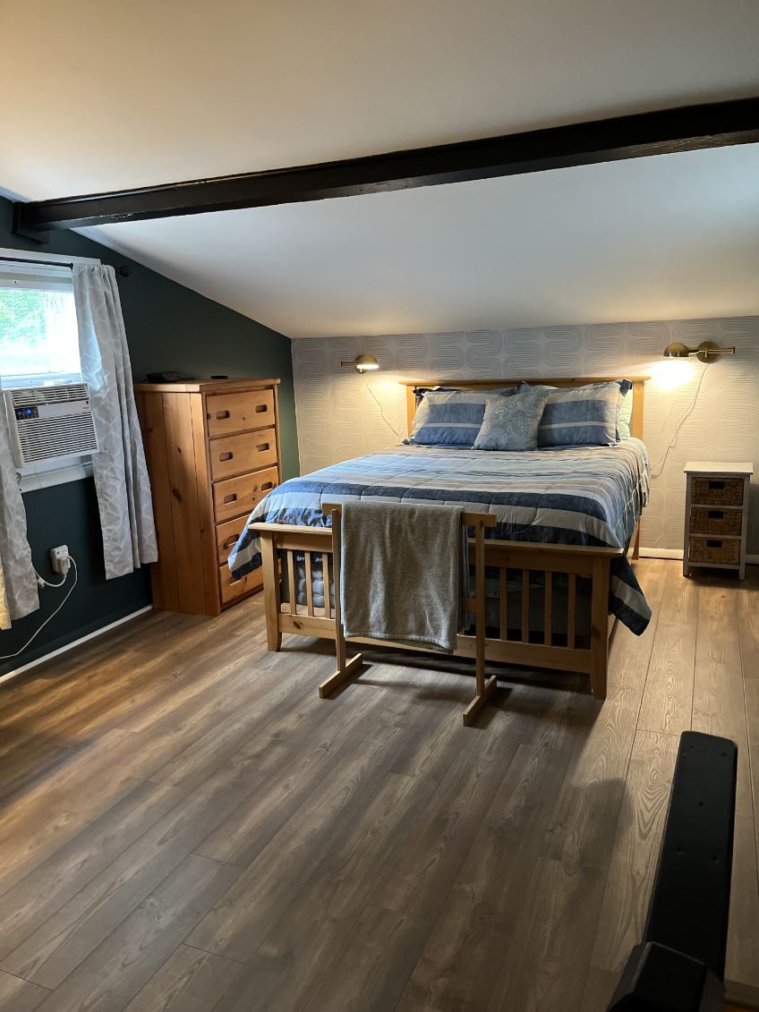 Loft bedroom with a queen bed.