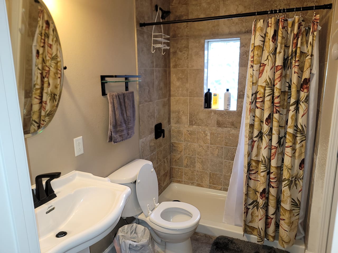 newly renovated bathroom, shampoo, shower gel provided