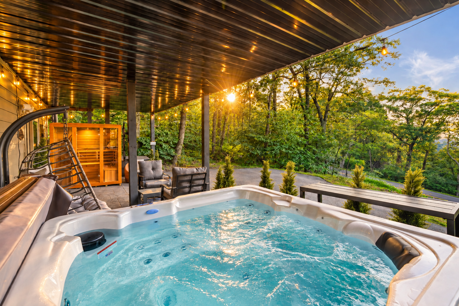 Covered hot tub and cedar sauna for year-round relaxation with filtered mountain views.  Cozy, dry, and peaceful - this lounge is perfect place to unwind, even on rainy days