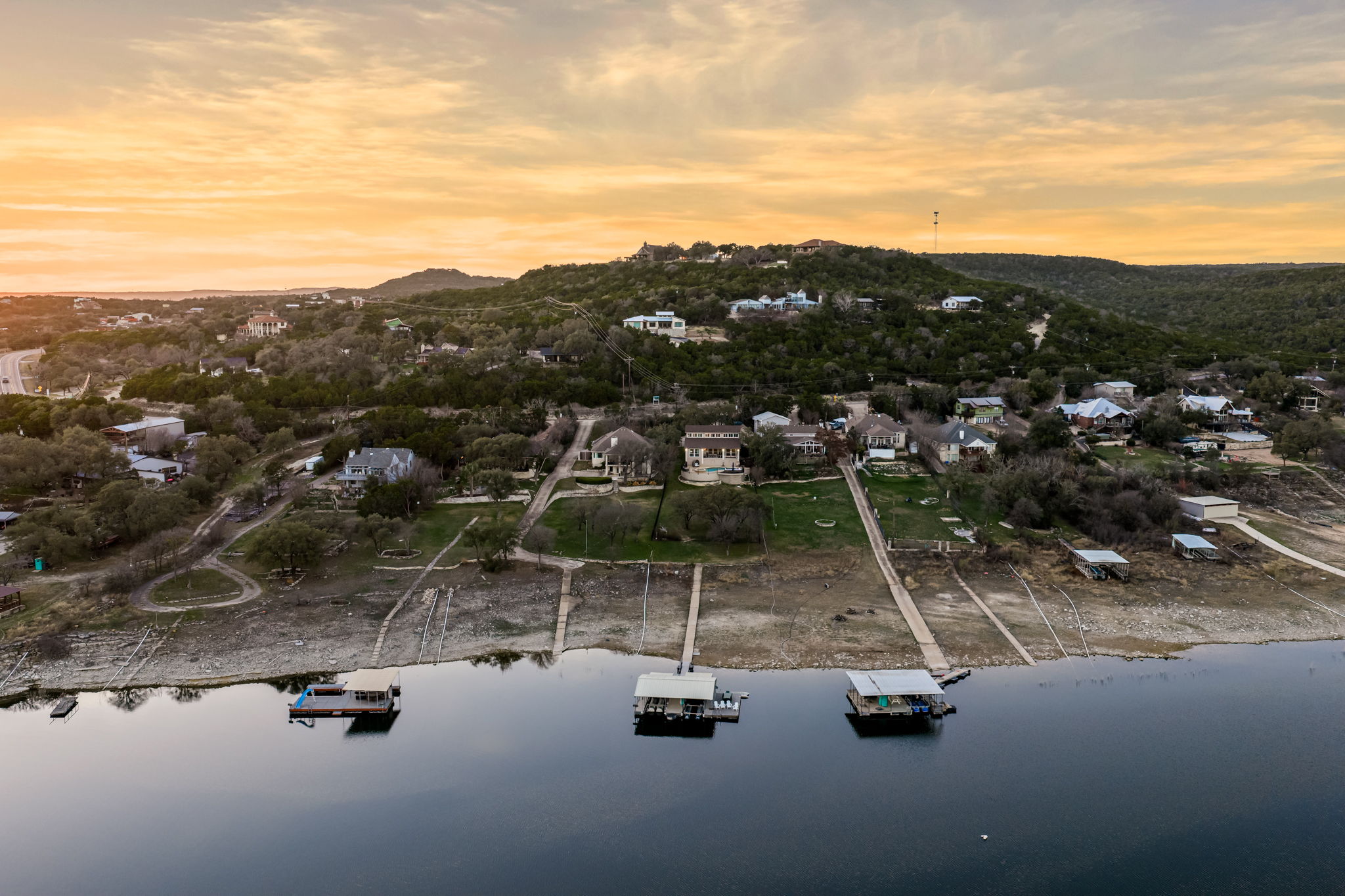 Aerial neighborhood view showcasing the home’s prime lakefront location.