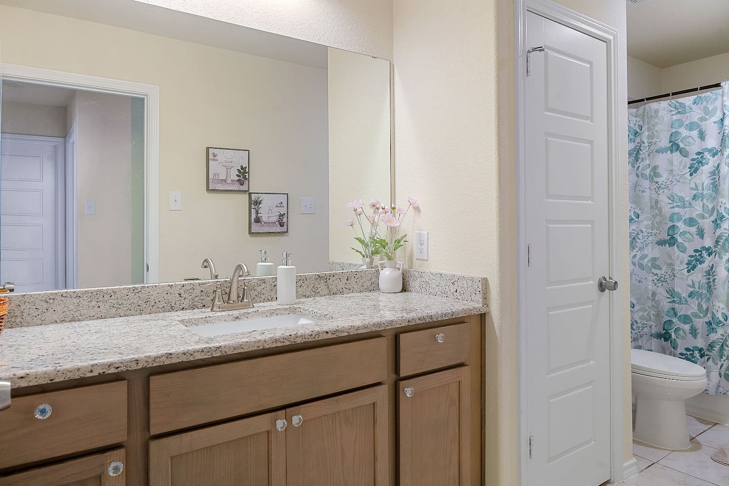 Step into a well-appointed bathroom featuring a spacious vanity and modern decor.