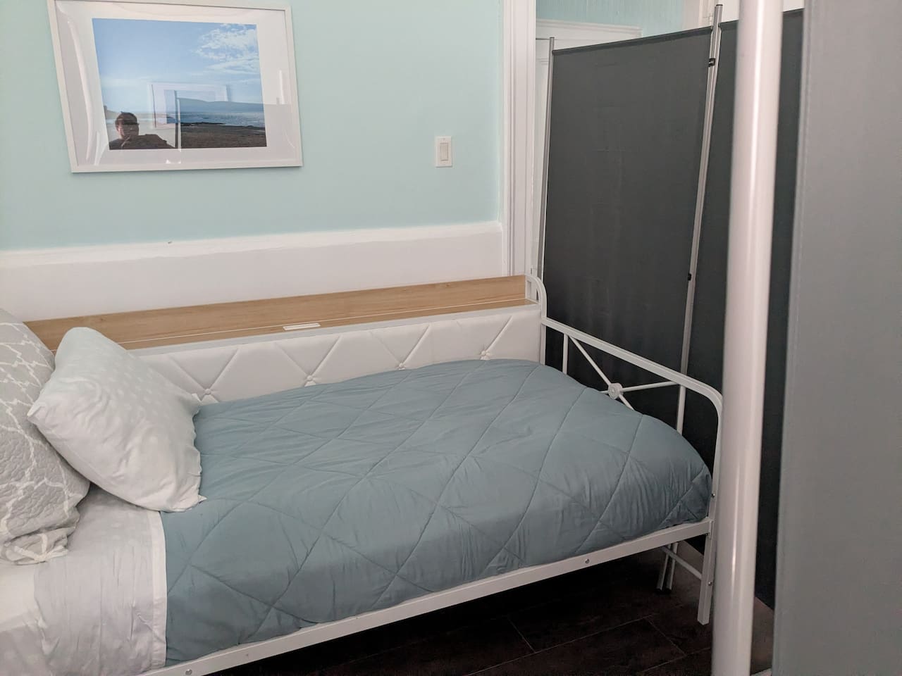 twin bed with privacy screen