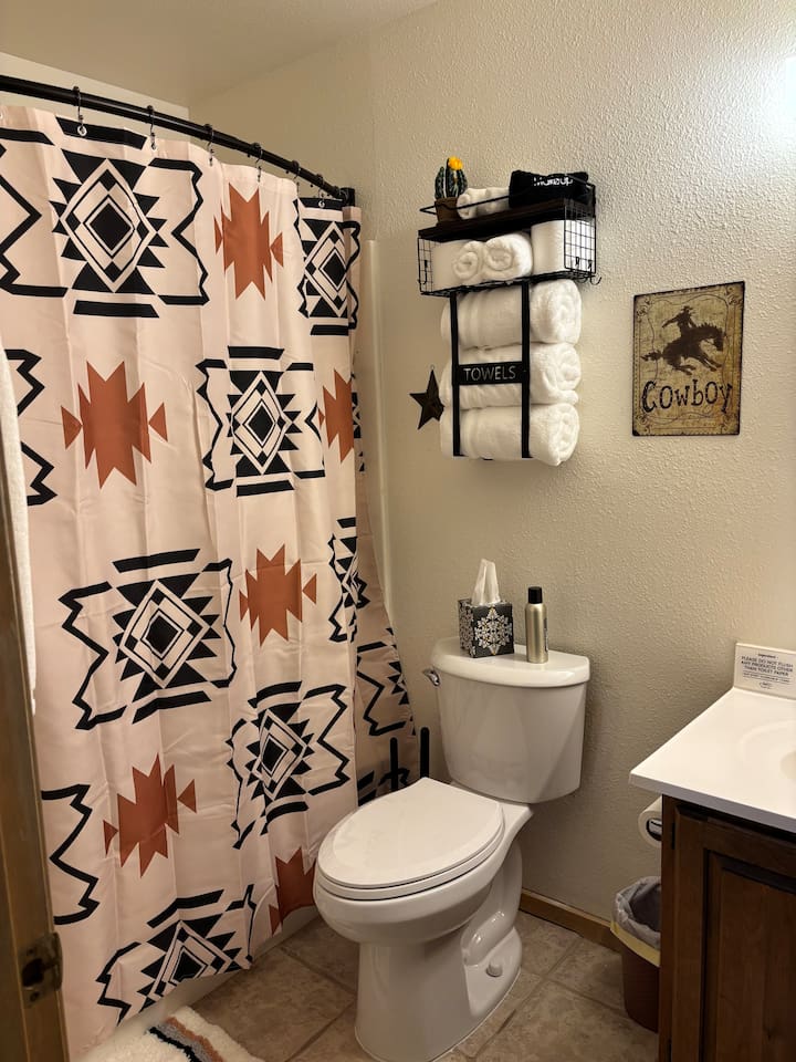 Full bathroom off Primary Bedroom with tub and shower.  Shampoo, conditioner and body wash provided