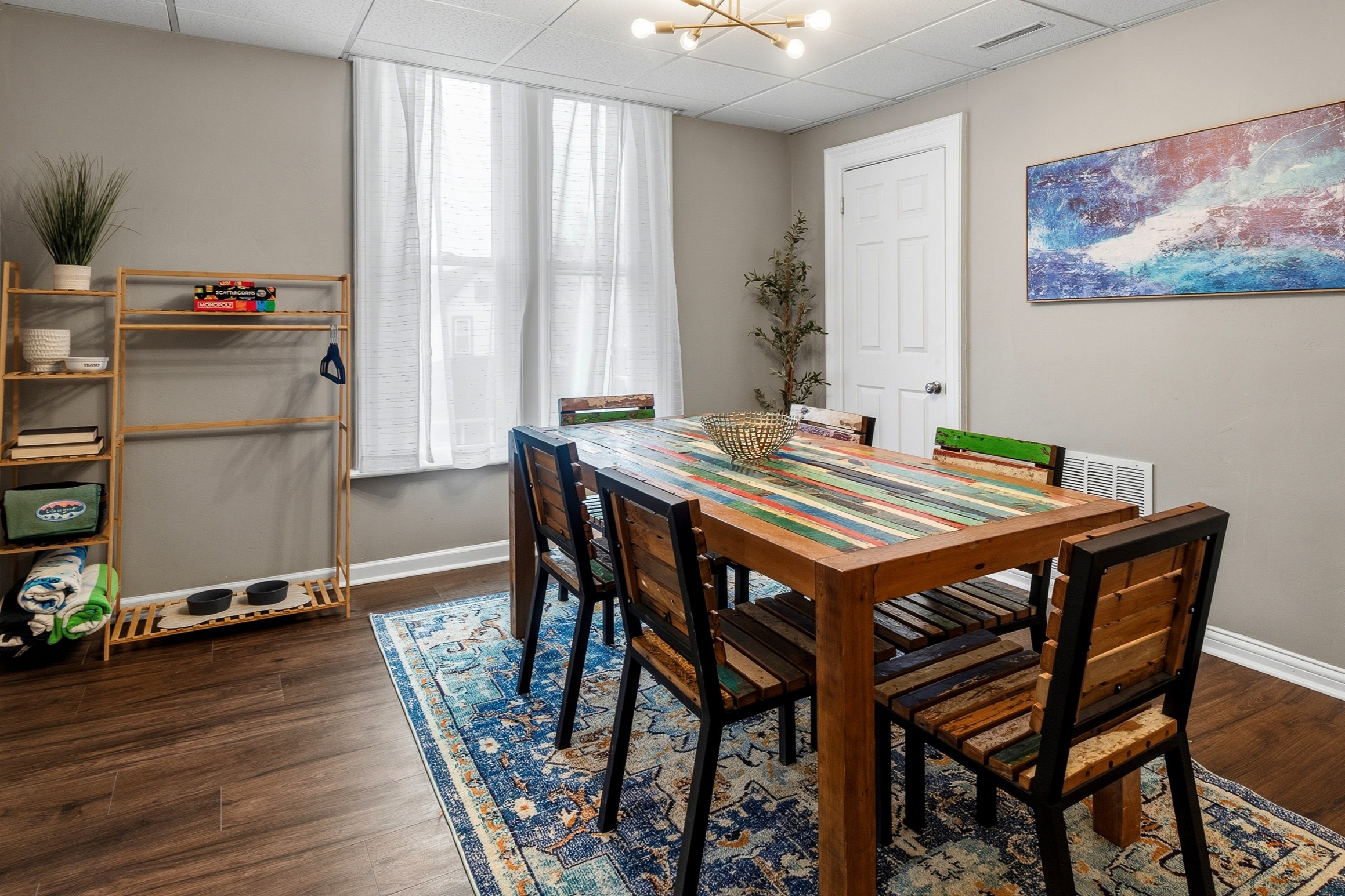 Colorful "upcycled" teak wood dining table seats six